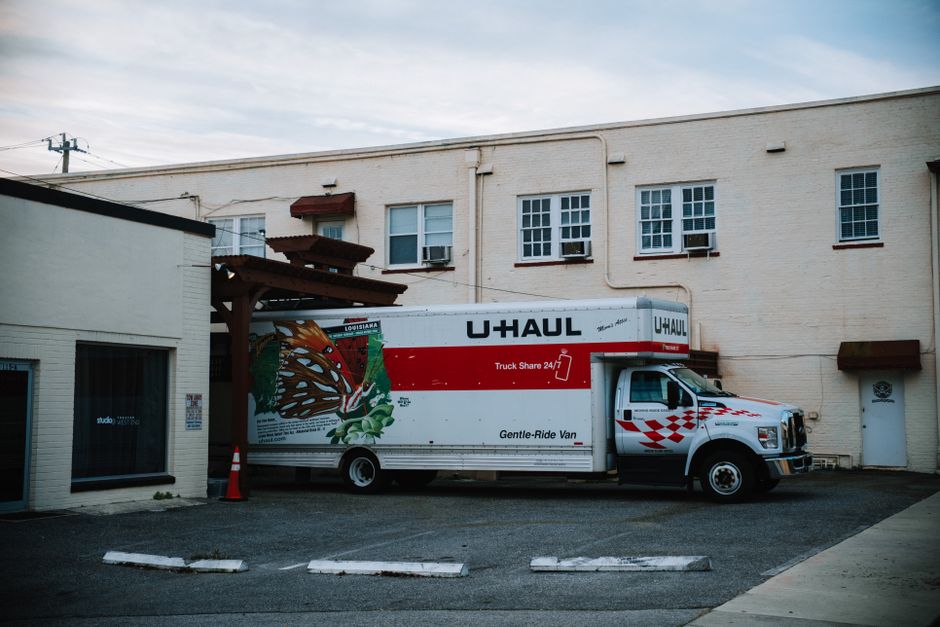 Moving truck outside a beautiful house